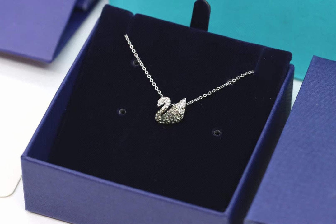 Swarovski Swan Pendant Necklace in Gold-Tone – Black Detail