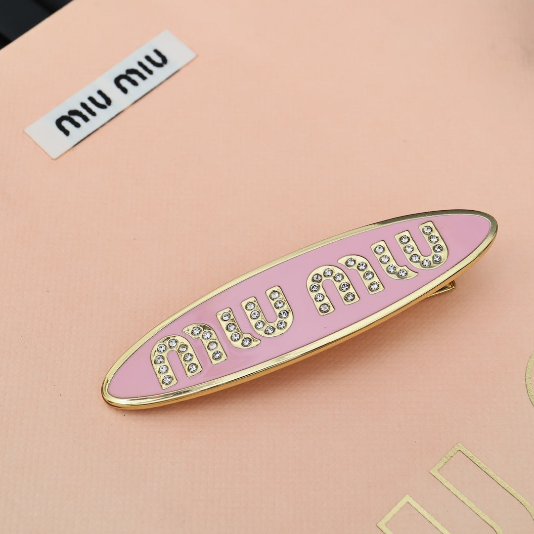 MIUMIU 26S CRYSTAL LOGO HAIR CLIP IN PINK ENAMEL AND GOLD TONE METAL 626894